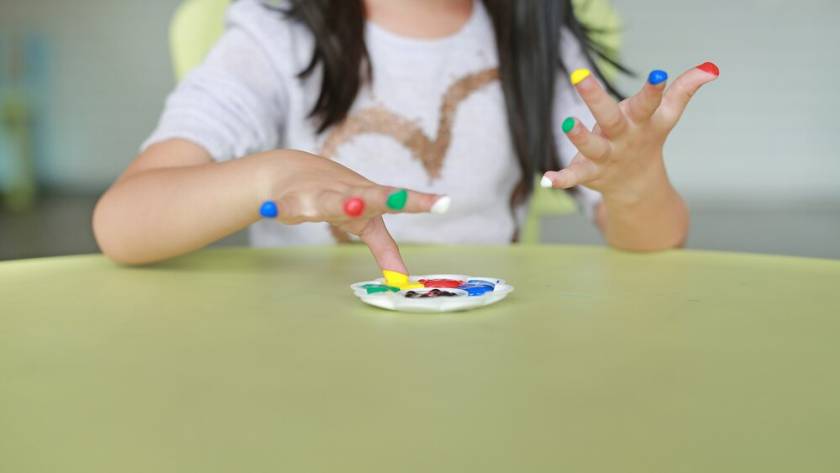 asian-girl-with-colorful-fingers-painted-children-room_38678-4783.jpg